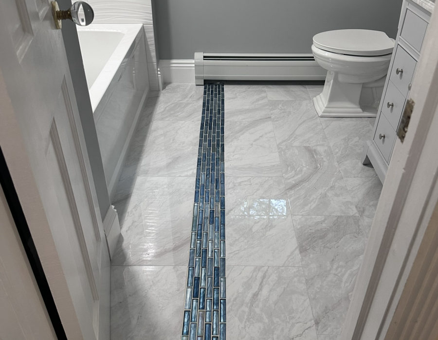 Modern bathroom remodel with walk-in tile shower by Hamlett Renovations